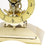 Socle doré d'une horloge de table avec mouvement squelette apparent et mécanique
