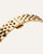 Goldfarbenes Metallarmband mit Gliederstruktur einer Armbanduhr