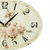 Horloge murale ronde avec verre, cadran crème et motif floral et papillon