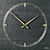 Horloge murale ronde avec cadran en ardoise naturelle, index dorés et centre en forme de croix