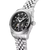 Silberfarbene Herrenarmbanduhr mit schwarzem Skelett-Zifferblatt und Edelstahlarmband