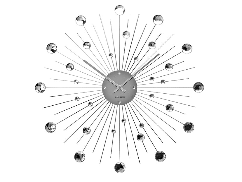 Grande horloge murale avec design à rayons et boules de cristal argentées, cadran rond