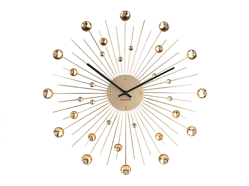 Grande horloge murale avec rayons de soleil, boules de cristal dorées et cadran rond