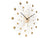 Horloge murale avec cristaux de verre dorés, aiguilles en forme d'étoile et cadran rond