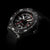 Montre homme avec cadran noir, accents lumineux rouges, bracelet textile noir et lunette encadrée