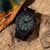 Luminox Herrenuhr mit grünem Zifferblatt, Leuchtindizes, schwarzem Gehäuse und Textilband