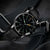 Bracelet de montre pour homme avec cadran rond noir, aiguilles luminescentes vertes et bracelet en cuir