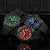 Quatre montres de plongée comparées : cadran bleu, vert et rouge avec bracelet noir