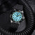 Montre homme avec cadran vert lumineux, bracelet en caoutchouc noir et guichet dateur