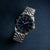 Montre pour femme avec cadran bleu, aiguilles lumineuses et bracelet en acier inoxydable