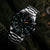 Montre chronographe pour homme avec bracelet en acier inoxydable, cadran noir et aiguilles lumineuses