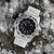 Montre Luminox pour homme avec bracelet blanc, cadran noir et index lumineux verts