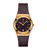 Armbanduhr mit burgundfarbenem Textilarmband, rundem goldfarbenem Gehäuse und Ziffernring