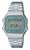 Casio Montre numérique vintage avec bracelet en métal, cadran vert et boutons latéraux