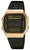 Montre numérique Casio avec boîtier doré et bracelet en métal noir, affichage lumineux