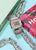 Casio Vintage watch with silver stainless steel bracelet next to colorful accessory