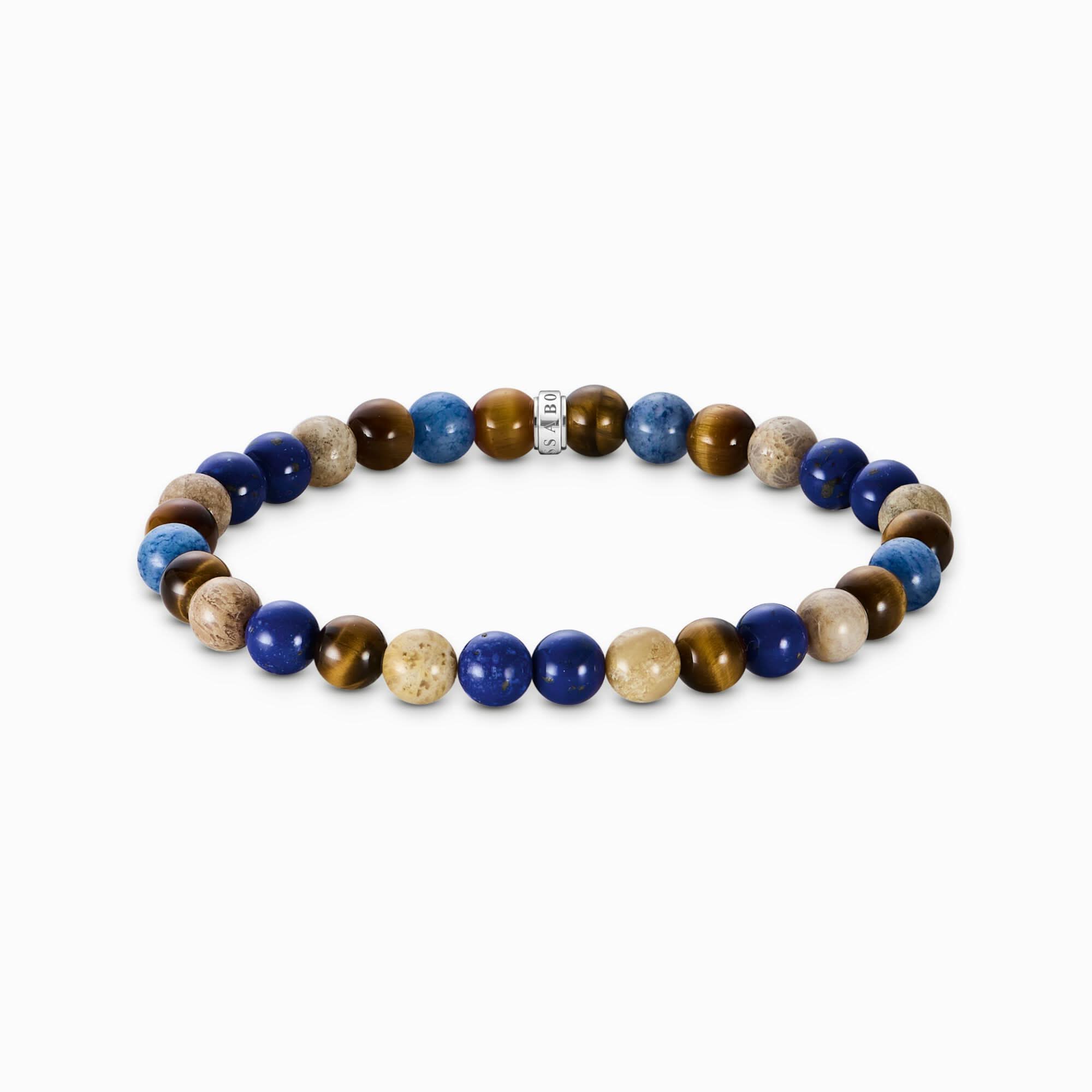 Bracelet en perles avec des billes bleues, marron et dorées, aspect élastique