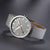 Montre unisexe avec bracelet textile gris et cadran gris, marqueur de seconde rouge