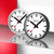 Ensemble d'horloges murales avec deux horloges rondes, cadran blanc, accents rouges et aiguilles noires
