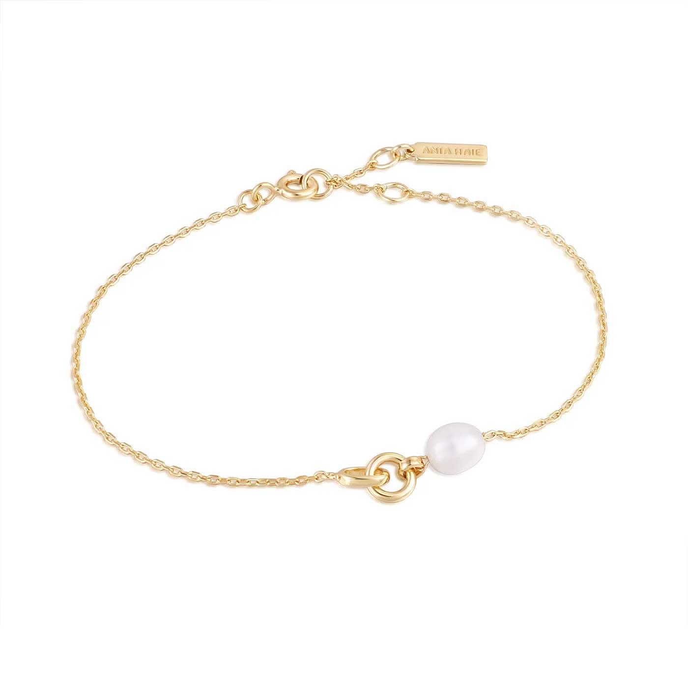 Bracelet doré avec pendentif perle sur chaîne délicate
