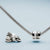 Charme en acier inoxydable sur bracelet chaîne avec incrustation de zircone, anneaux latéraux visibles