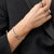 Bracelet avec breloque en acier inoxydable, incrustation de zircone et segment noir