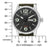 Montre bracelet pour homme, vue de face avec échelle de mesure ; cadran noir et bracelet textile vert