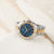 BOSS Hero Sport Bicolor-Armbanduhr mit silber-goldenem Metallarmband und blauem Zifferblatt