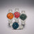 Set Herrenquarzuhren mit Edelstahlarmband und farbigen Zifferblättern (orange, rot, grün, blau)