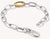 Bracelet articulé avec maillons argentés et élément de connexion doré