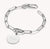 Bracelet gourmette argenté avec maillon Connect, fermoir mousqueton et médaille ronde gravée