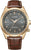 Montre homme avec bracelet en cuir marron, lunette dorée et cadran sombre, guichet date