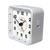 Réveil radio-piloté blanc avec cadran analogique et face de commande sur le boîtier