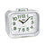 Petit réveil avec boîtier blanc et cadran lumineux, inscription Quartz