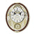 Horloge murale ovale, cadran blanc avec ornements dorés et chiffres romains