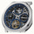 Herrenuhr: Nahansicht des blauen Skelettzifferblatts mit zwei Hilfsziffern und Automatik-Label.