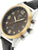 Montre homme finition dorée avec cadran noir et bracelet en cuir noir, design chronographe