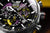 Montre homme Détail : cadran noir avec index jaunes et compteurs chronographes