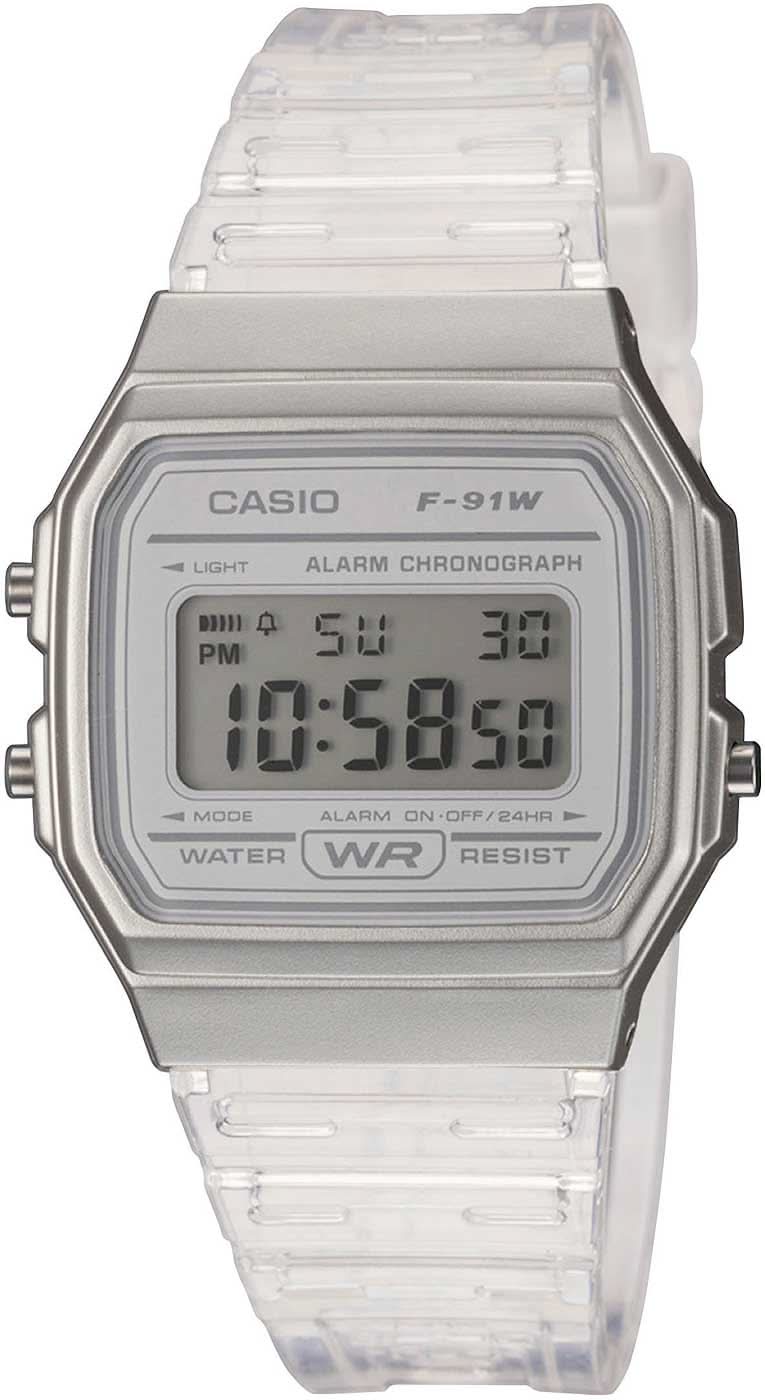 Montre numérique LCD Casio pour femme avec boîtier argenté et bracelet transparent en plastique.