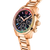 Montre pour femme avec boîtier en or rose, lunette ornée de pierres colorées et cadran noir