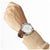 Festina Chronograph Herrenuhr mit braunem Lederarmband und silbernem Gehäuse auf Handgelenk