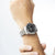 Herren-Armbanduhr mit schwarzem Zifferblatt und Metallarmband
