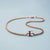 Bracelet chaîne avec breloque couleur or rose et insert tressé bleu