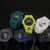 Casio G-Shock Herrenuhren in mehreren Farben, türkis, gelb, weiß, mit runden Anzeigen