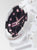 Montre G-Shock pour femme avec cadran noir et index roses sur l'écran