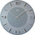 Horloge murale ronde avec cadran gris, index argentés et logo JVD