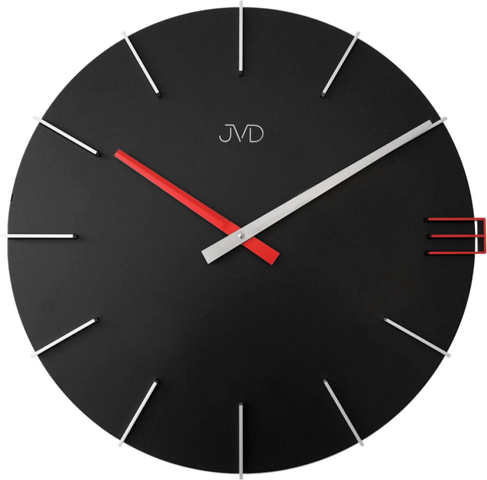 Horloge murale JVD avec cadran noir, accents rouges et aiguilles blanches