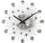 JVD Wanduhr mit Metall-Design, runden Zeigerachsen und Strahlen, glänzenden Glasknöpfen