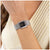 Damenuhr BOSS mit schwarzem Zifferblatt, rechteckigem Edelstahlgehäuse und Gliederarmband