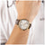 Chronograph Herrenarmbanduhr: goldfarbenes Gehäuse, braunes Lederband, weißes Zifferblatt